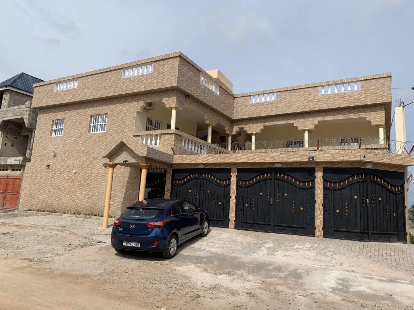 A residential property with a car parked outside